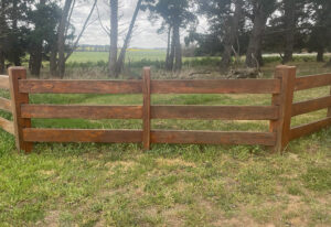 Three rail timber fence