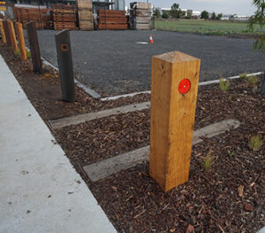 Timber bollards with lights supplied by Norwood Products